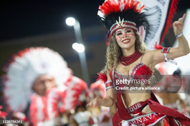 February 2022, Brazil, Rio De Janeiro: Members of the street carnival group Cacique de Ramos parade during the opening event of the Carnival of the...