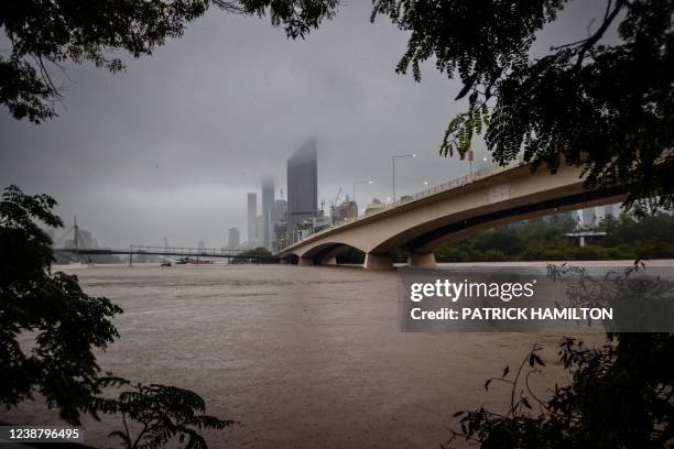 The overflowing Brisbane River is seen from South Bank, Australia's Queensland state on February 27, 2022.