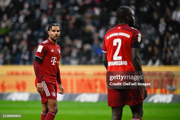 Serge Gnabry of Bayern Muenchen and Dayot Upamecano of Bayern Muenchen look on during the Bundesliga match between Eintracht Frankfurt and FC Bayern...
