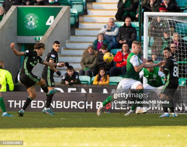 Celtic's Portugese forward, Jota, fires over the bar as Hibs centre-back, Ryan Porteous, tries to block during the Cinch Scottish Premiership match...