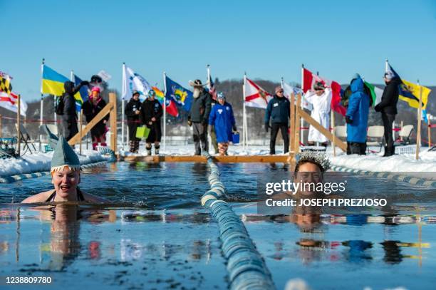 Swimmers compete in the 25 meter hat competition during the Memphremagog Winter Swimming Festival in Newport, Vermont, on February 26, 2022. - 122...