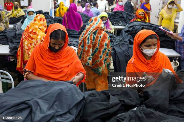 Ready-made garments worker works in a garments factory in Dhaka, Bangladesh on February 27, 2022.