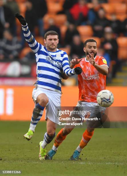 Blackpool's Kevin Stewart battles with Reading's John Swift during the Sky Bet Championship match between Blackpool and Reading at Bloomfield Road on...