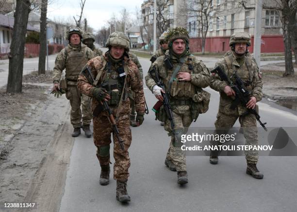 Servicemen of Ukrainian Military Forces walk in the small town of Sievierodonetsk, Lugansk Oblast, on February 27, 2022. - Ukraine said that it had...
