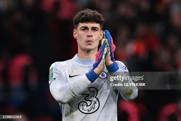 Chelsea's Spanish goalkeeper Kepa Arrizabalaga applauds the fans after a penalty shoot-out during the English League Cup final football match between...