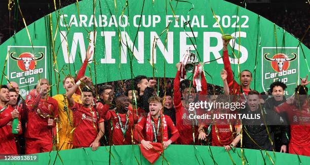 Liverpool players celebrate with the winner's trophy after the English League Cup final football match between Chelsea and Liverpool at Wembley...