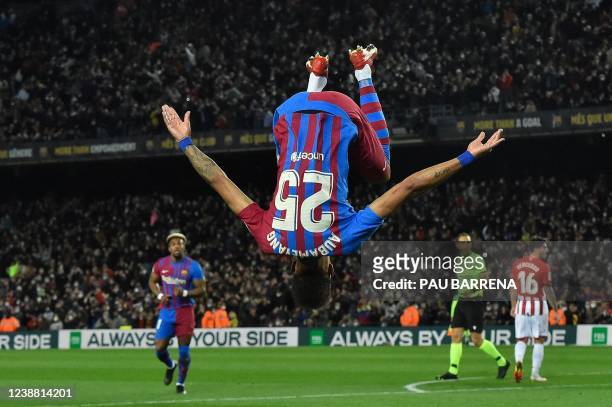 Barcelona's Gabonese midfielder Pierre-Emerick Aubameyang does a somersault celebrates after scoring his team's first goal during the Spanish league...
