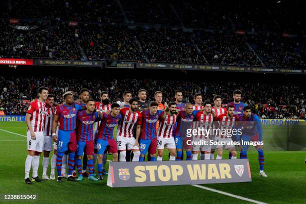 Players of Athletic Bilbao and FC Barcelona posing for a banner Stop the War between Russia and Ukraine during the La Liga Santander match between FC...