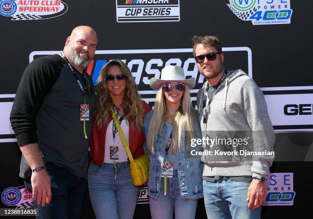 Super bowl champions tackle Andrew Whitworth of the Los Angeles Rams and his wife Melissa quarterback Matthew Stafford and his wife and Kelly pose on...
