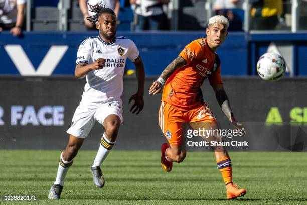 Santiago Rodriguez of New York City battles Raheem Edwards of Los Angeles Galaxy during the match at the Dignity Health Sports Park on February 27,...