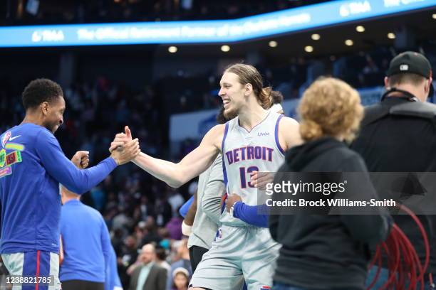 Kelly Olynyk of the Detroit Pistons and Rodney McGruder of the Detroit Pistons celebrate after the game against the Charlotte Hornets on February 27,...