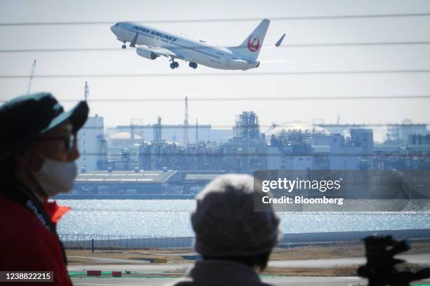 Japan Airlines Co., Ltd. Aircraft takes off at Haneda Airport in Tokyo, Japan, on Saturday, Feb. 26, 2022. The first phase of Japan's easing on...