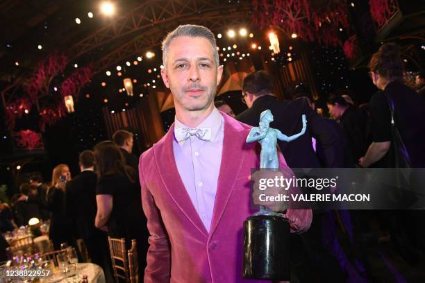 Actor Jeremy Strong poses with the award for Outstanding Performance by an Ensemble in a Drama Series Succession during the 28th Annual Screen Actors...