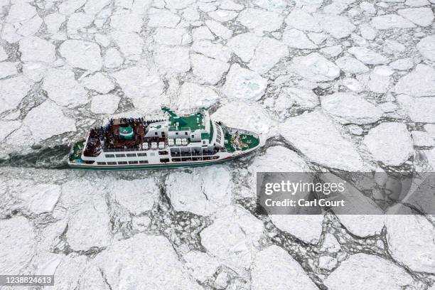 An ice-breaking tour boat pushes through drift ice on the Sea of Okhotsk on February 24, 2022 in Abashiri, Japan. The temperature of the Sea of...