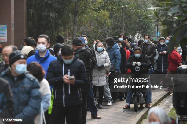 Residents line up to get tested for Covid-19 in a residential block in Wuhan in central Chinas Hubei province Tuesday, Feb. 22, 2022. Fourteen new...