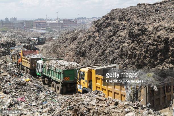 Trucks line up to unload garbage at the Dandora Dumping site every day; an overage of 2000 metric tonnes of garbage from all over Nairobi is taken to...