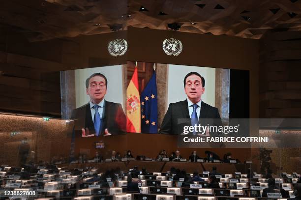 Spanish Minister of Foreign Affairs, European Union and Cooperation, Jose Manuel Albares appears on a screen as he gives a remote speech at the...