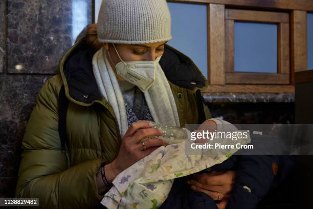 German citizen Maria feeds her baby Leo in the train station on February 28, 2022 in Kyiv, Ukraine. Leo was born on Valentine's Day from a surogate...