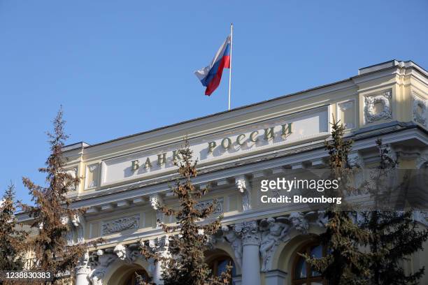 Russian national flag above the headquarters of Bank Rossii, Russia's central bank, in Moscow, Russia, on Monday, Feb. 28, 2022. The Bank of...