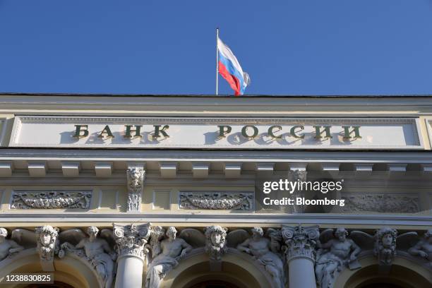 Russian national flag above the headquarters of Bank Rossii, Russia's central bank, in Moscow, Russia, on Monday, Feb. 28, 2022. The Bank of...