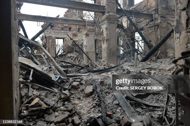 This photograph shows a view of a school destroyed as a result of fight not far from the centre of Ukrainian city of Kharkiv, located some 50 km from...