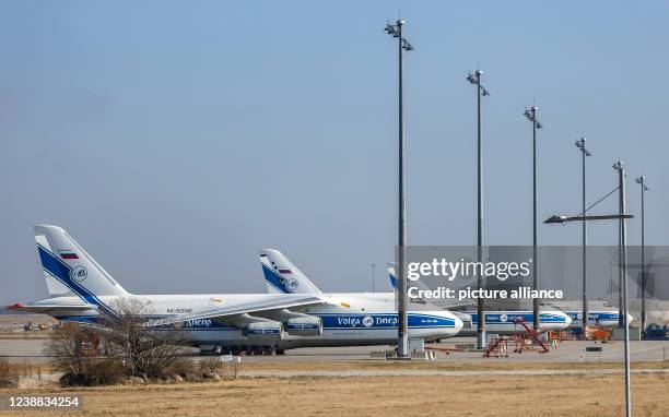 February 2022, Saxony, Schkeuditz: Three Antonov An-124 cargo aircraft of the Russian Volga-Dnepr Group are parked at Leipzig/Halle Airport. The...