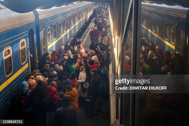 People board an evacuation train at Kyiv central train station on February 28, 2022. - The Russian army said on February 28 that Ukrainian civilians...