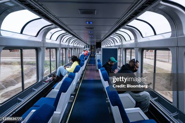 Passengers travel in the observation deck of on an Amtrak train near Memphis, Tennessee, U.S., on Friday, Feb. 25, 2022. Amtrak is expecting to...