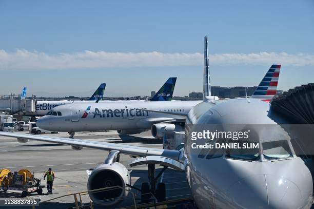 American Airlines planes are seen at Los Angeles International Airport on February 28, 2022 in Los Angeles.
