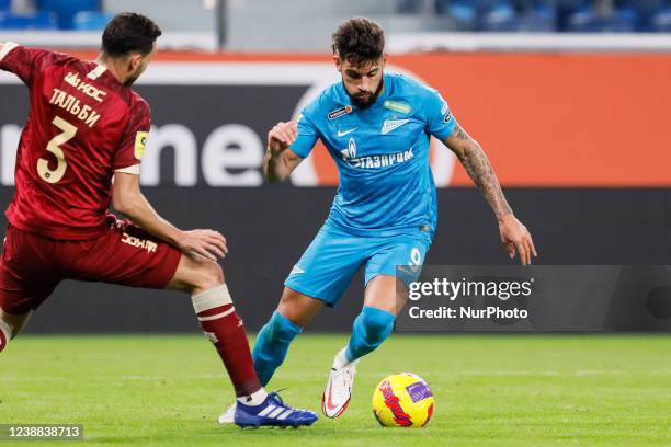 Yuri Alberto of Zenit St. Petersburg dribbles past Montassar Talbi of Rubin during the Russian Premier League match between FC Zenit Saint Petersburg...