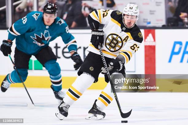 Boston Bruins left wing Brad Marchand carries the puck during the NHL game between the San Jose Sharks and the Boston Bruins on February 26, 2022 at...