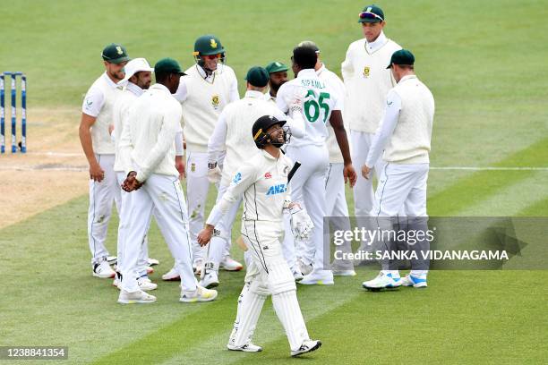 New Zealand's Devon Conway reacts as he walks back to the pavilion after his dismissal on day five of the second cricket Test match between New...