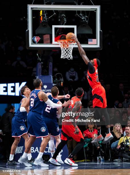 Chris Boucher of the Toronto Raptors dunks the ball against the Brooklyn Nets at Barclays Center on February 28, 2022 in the Brooklyn borough of New...