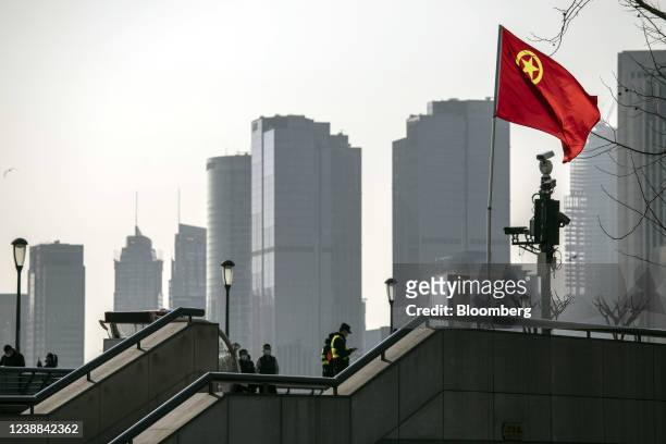 The Communist Youth League of China flag flies on the Bund in Shanghai, China, on Friday, Feb. 27, 2022. China's Politburo vowed to strengthen...