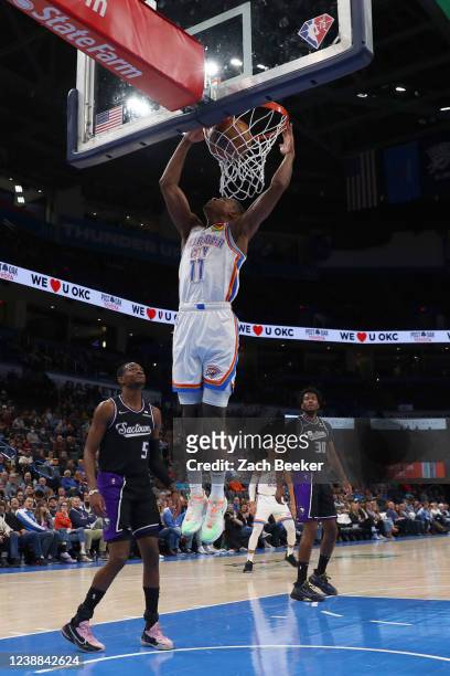 Theo Maledon of the Oklahoma City Thunder dunks the ball during the game against the Sacramento Kings on February 28, 2022 at Paycom Arena in...