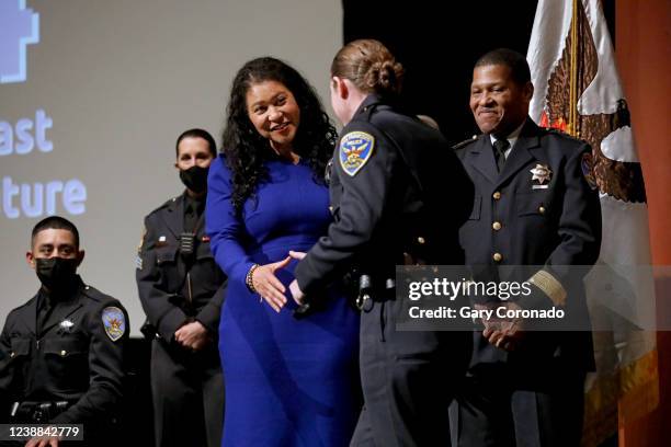 London Breed, mayor of San Francisco, third from left, congratulates Chelsea Weidinger , after she received her star from William Scott, right, chief...