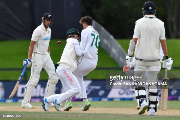 South Africa's Sarel Erwee and Marco Jansen collide as they attempt to make a catch to dismiss New Zealand's Kyle Jamieson on day five of the second...