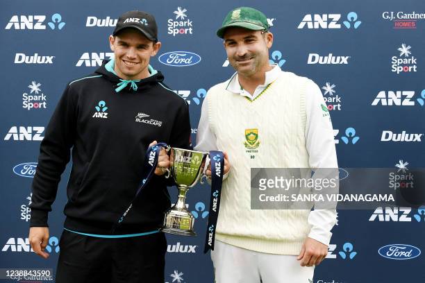 New Zealand's captain Tom Latham and South Africa's captain Dean Elgar pose with the trophy at the end of day five of the second cricket Test match...
