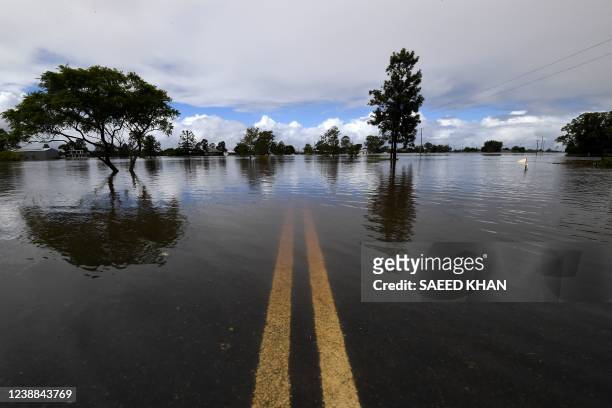 General view of a flooded street is seen in Lawrence, some 70 kms from the New South Wales town of Lismore, on March 1, 2022.