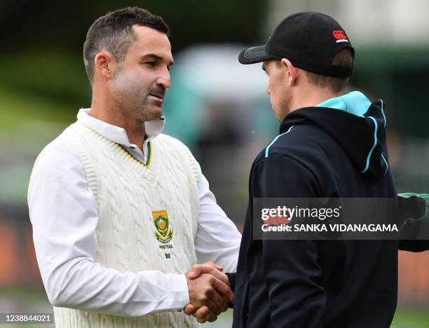 New Zealand's captain Tom Latham talks with South Africa's captain Dean Elgar during the presentation ceremony at the end of day five of the second...