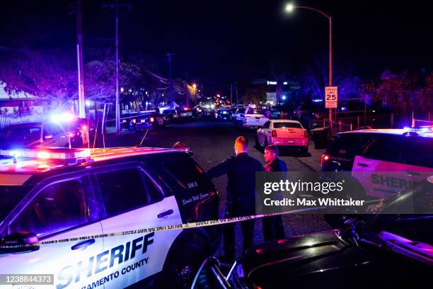 Police officers investigate the scene of a shooting at The Church in Sacramento on February 28 in Sacramento, California. Police have said a father...