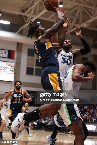 Gerard Tarin of the Salt Lake City Stars goes up for the shot against Chris Silva and Matt Lewis of the Iowa Wolves at Bruins Arena on February 28,...