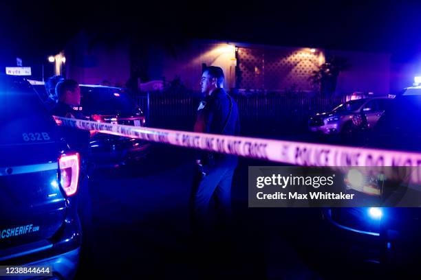 Police officers investigate the scene of a shooting at The Church in Sacramento on February 28 in Sacramento, California. Police have said a father...