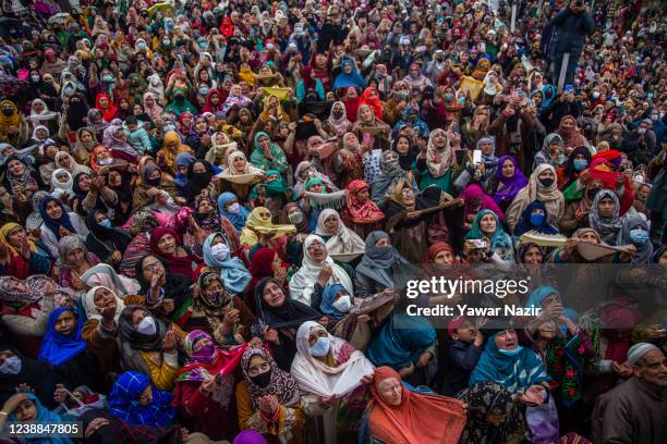 Kashmiri Muslim women pray as a Muslim cleric displays the holy relic believed to be the whisker from the beard of the Prophet Mohammed at the...