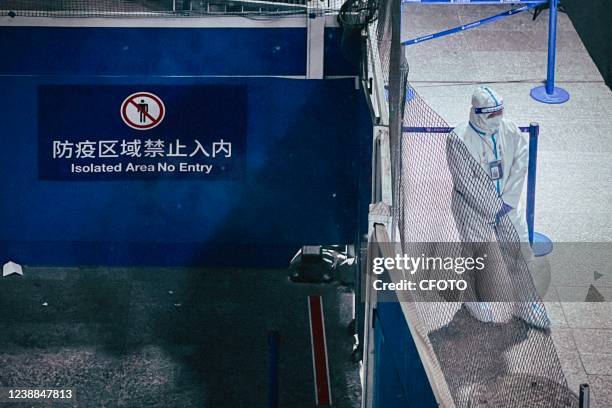 Epidemic prevention vehicles transport passengers at Shanghai Pudong International Airport in Shanghai, China, on the early morning of February 24,...