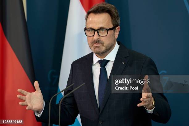 Luxembourg's Prime Minister Xavier Bettel attend a news conference with German Chancellor Olaf Scholz at the Chancellery on March 1, 2022 in Berlin,...