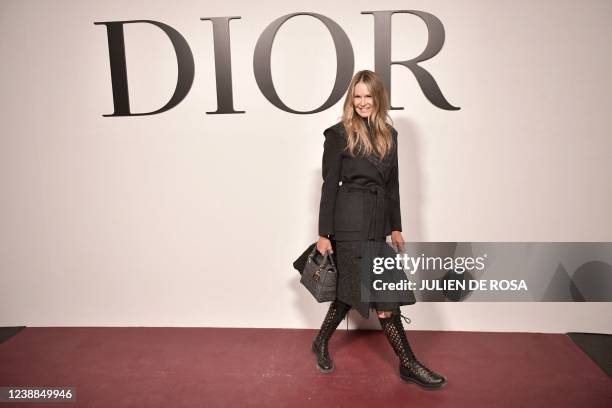 Australian former model and actress Elle Macpherson poses for a photocall for the Christian Dior Fall-Winter 2022-2023 collection fashion show during...