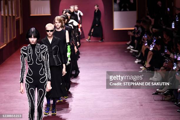 Models present creations for the Christian Dior Fall-Winter 2022-2023 collection fashion show during the Paris Womenswear Fashion Week, in Paris, on...