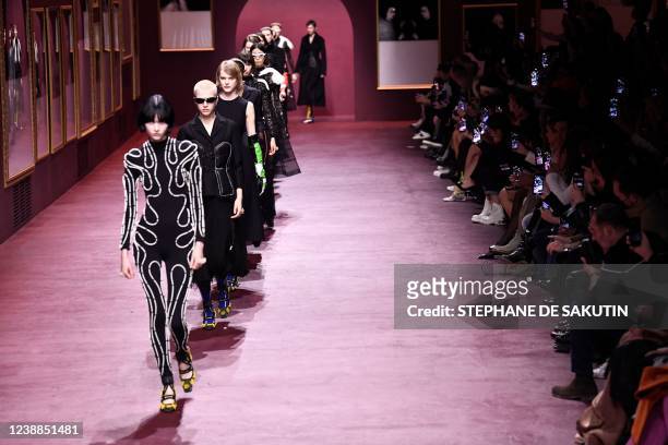 Models present creations for the Christian Dior Fall-Winter 2022-2023 collection fashion show during the Paris Womenswear Fashion Week, in Paris, on...