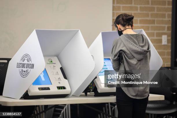 People vote at the Carver Branch Library on March 1, 2022 in Austin, Texas. Today Texans are headed to the polls to vote in the states first primary...